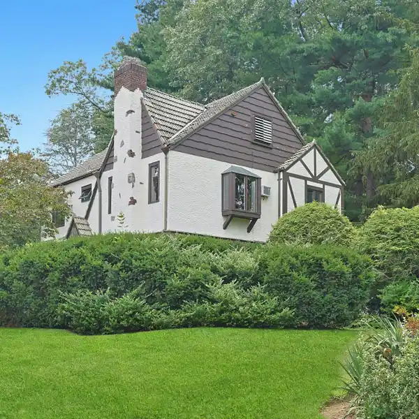 CHARMING BRICK AND STONE TUDOR HOME