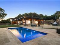 CUSTOM-BUILT LUXURY ON OVER FIVE PRIVATE ACRES