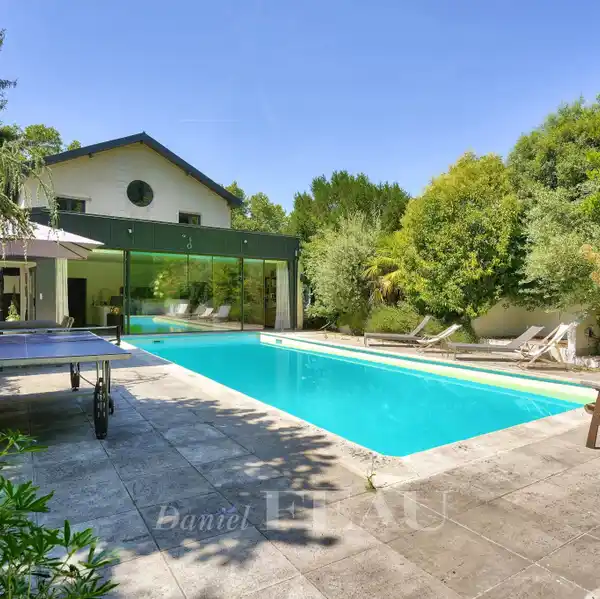 CONTEMPORARY ESTATE WITH HEATED POOL AND PRIVATE STUDIO