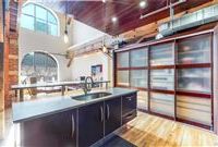 ONE-OF-A-KIND TWO-STORY HISTORIC BRICK AND TIMBER LOFT