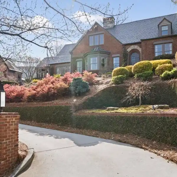 BRICK TUDOR HOME WITH CARRIAGE HOUSE