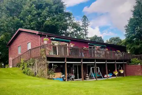 Log Sided Dual Level Lake Home