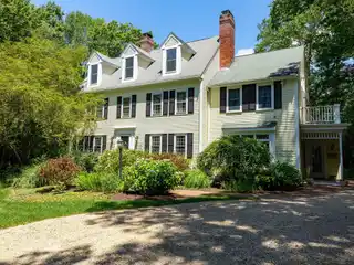 Timeless Colonial Charm on Private Acre Lot