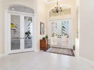 Custom Home on a Lush Private Acre in Bay Hill Estates