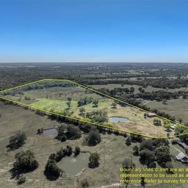 EXPANSIVE ACREAGE WITH VERSATILE BARNDOMINIUM RETREAT