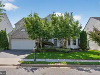 Refined Living with Dual Suites and Sunroom Charm