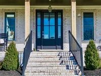 MASSIVE CUSTOM HOME OFFERING PRIVACY AND SERENITY