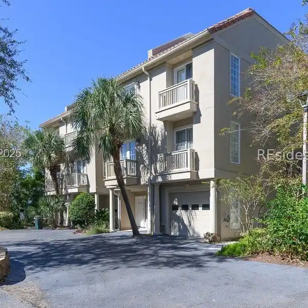 SOPHISTICATED INTERIORS FEATURING HIGH CEILINGS AND WOOD FLOORS