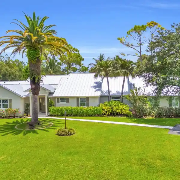 OVERSIZED LOT WITH TROPICAL POOL OASIS IN 24-HOUR GATED COMMUNITY