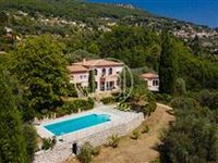THIS IMPOSING NEO PROVENCAL VILLA OFFERS A MAGNIFICENT VIEW OVER THE COUNTRYSIDE TO THE SEA