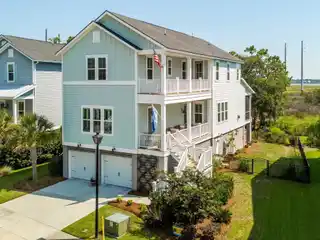 Elevated Living in a Revered Waterfront Community