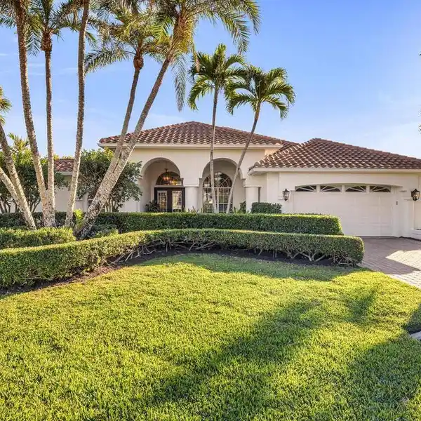 BEAUTIFULLY MAINTAINED LAKEFRONT POOL HOME