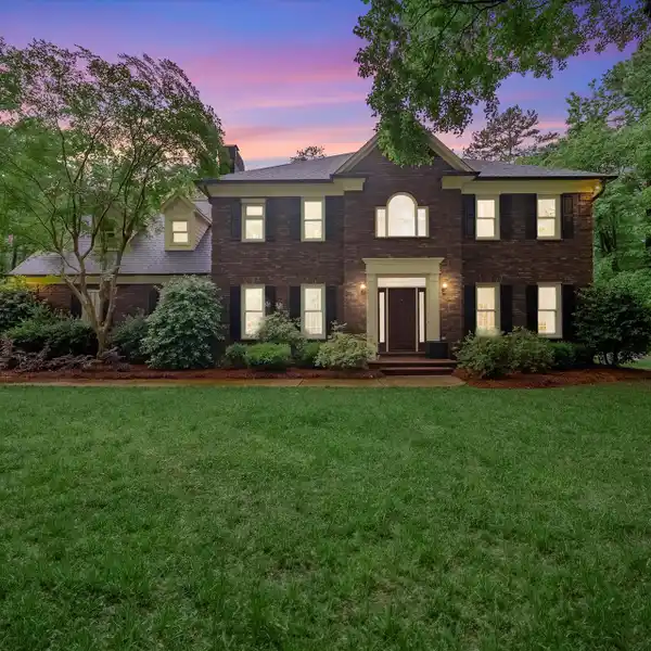 CHARMING BRICK HOME ON A WOODED LOT