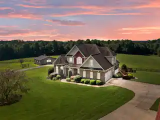 Versatile Country Estate with Barn, Pool, and Creek