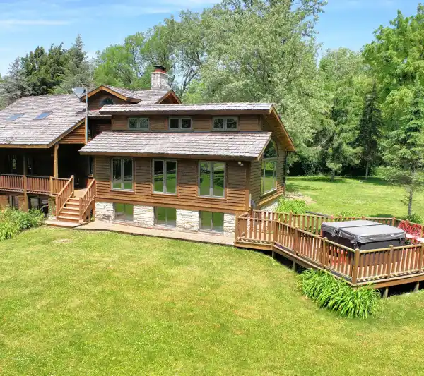 UNIQUE LOG HOME ON 49.55 WOODED ACRES
