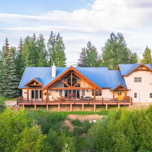 MASTERFULLY CRAFTED LOG HOME ON OVER TEN ACRES