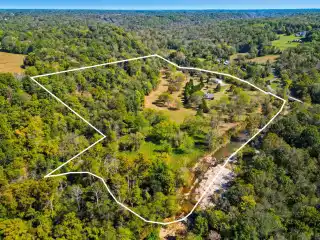 Private Creekfront Estate with Unparalleled Privacy