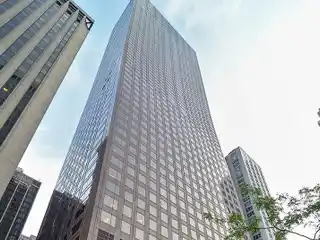 Sky-High Duplex with Floating Staircase and Lake Views