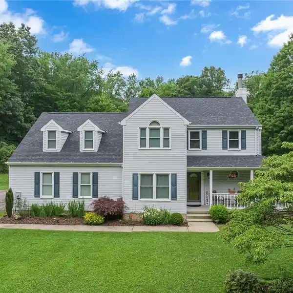 PRIVATE ACREAGE RETREAT WITH POOL AND GARAGES