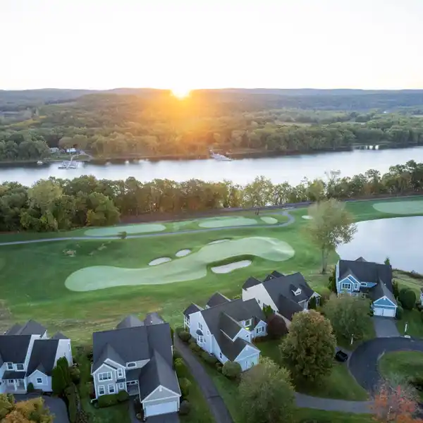 FAIRWAY-FACING ESTATE WITH RIVERFRONT SERENITY