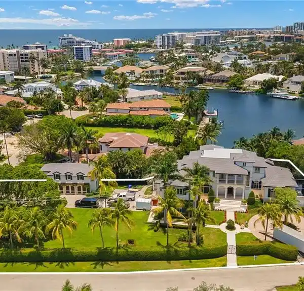 FULLY REIMAGINED ESTATE ON A RARE CORNER WATERFRONT LOT