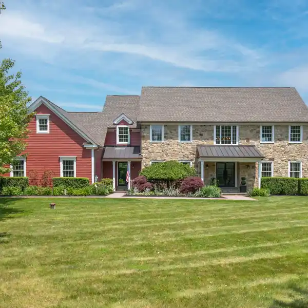 STUNNING COLONIAL ON PRIVATE THREE-ACRE SETTING