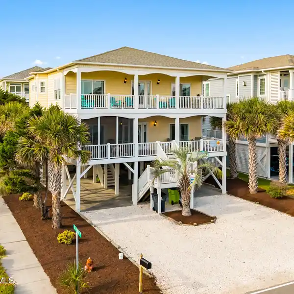 TURN-KEY COASTAL ESCAPE STEPS FROM THE SAND