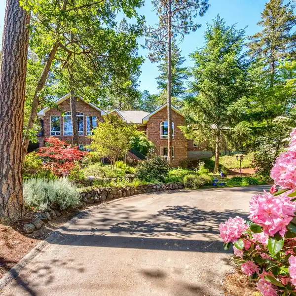 BEAUTIFUL HOME ON TWO PARK-LIKE ACRES