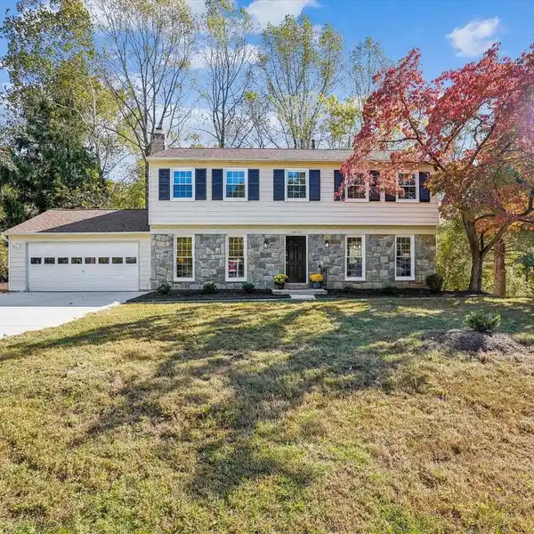 RENOVATED CUL-DE-SAC COLONIAL WITH STREAMSIDE VIEWS