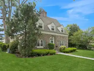 Surprisingly Spacious Stone and Brick Center-hall Colonial