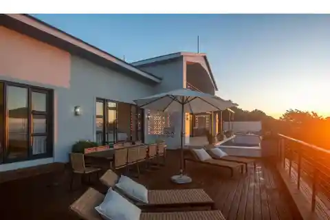Modern Coastal Gem with Dual Sunset Vistas