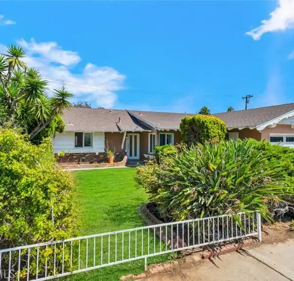 SPACIOUS CORNER LOT WITH SUNROOM AND PATIO