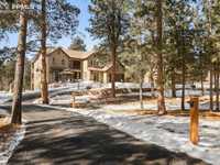 ENCHANTING CUSTOM HOME IN EXCLUSIVE GATED COMMUNITY