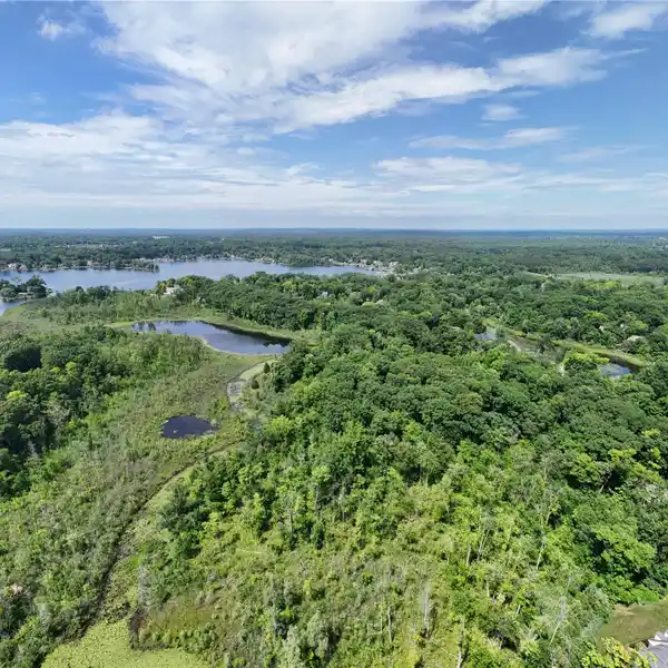 13.5-ACRE WOODED SANCTUARY ON COMMERCE LAKE