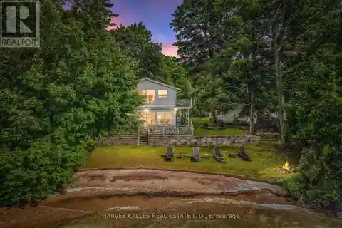 Rare Waterfront Home with Private Beach