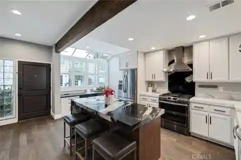 Extensively Renovated Townhome Blocks from the Sand