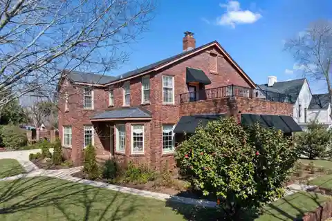 Tudor-Style Brick Pool Home in Historic East Hill