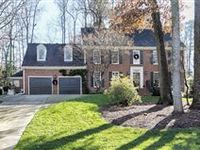 ALL BRICK NORTH RIDGE HOME ON PRIVATE WOODED PROPERTY