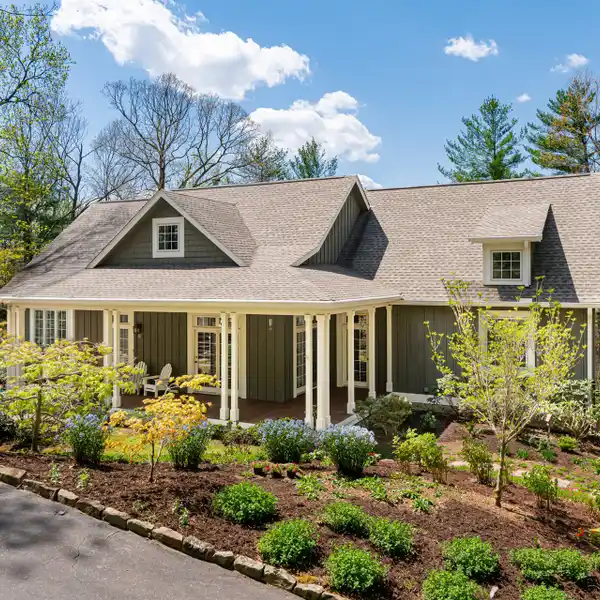 CHARMING CRAFTSMAN STYLE HOME IN A PRIVATE WOODED SETTING