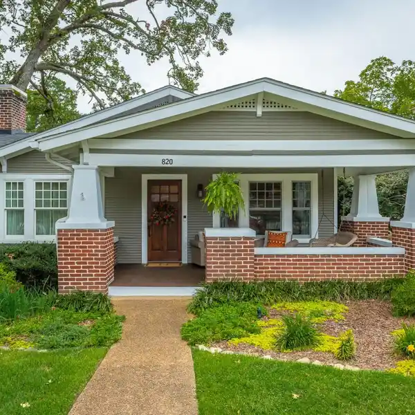 ELEGANT HOME WITH FRONT PORCH AND LUSH LANDSCAPING