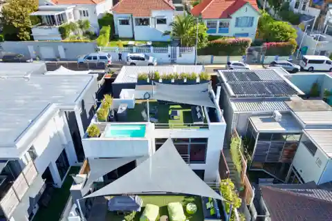 Designer Retreat with Rooftop Pool and Sea Views