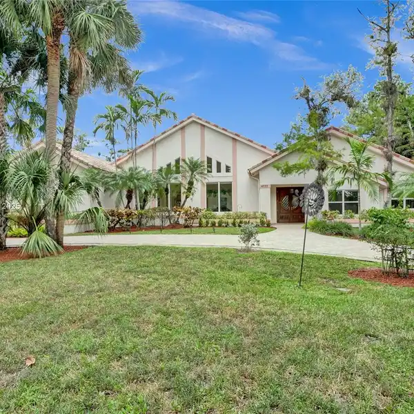 SPACIOUS CUSTOM HOME ON A WOODED ACRE