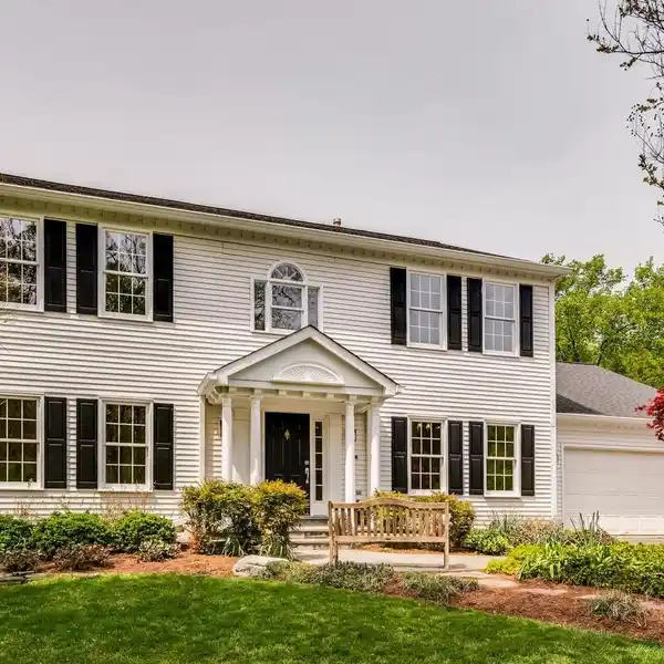 ELEGANT COLONIAL RETREAT ON TRANQUIL ONE-ACRE LOT