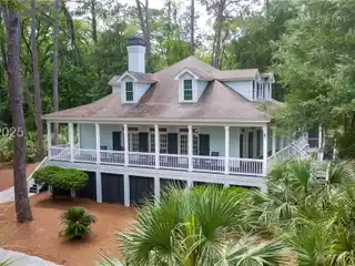 Discover Coastal Living at Its Finest in This Stunning 3,883 Square Foot Home Located in the Exclusive Haig Point Community.