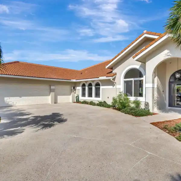 SOPHISTICATED RESIDENCE IN THE COVETED BANYAN LAKES GATED COMMUNITY