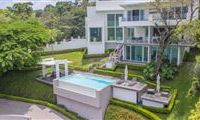 WONDROUS HOME SURROUNDED BY A GREEN GARDEN