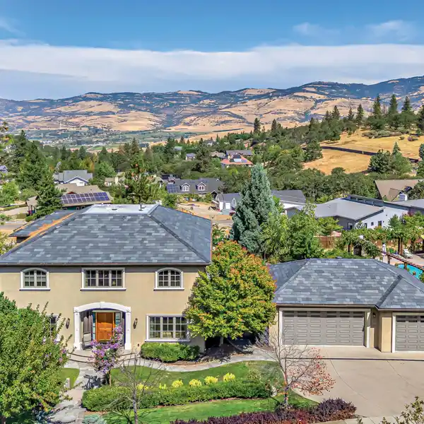 FRENCH PROVINCIAL-INSPIRED CUSTOM HOME WITH TWO LOTS