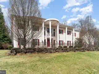 Stunning Colonial Masterpiece Nestled on a Sprawling Lot