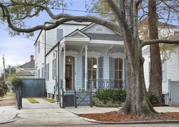 EASTLAKE VICTORIAN SIDE HALL COTTAGE WITH CARRIAGE HOUSE