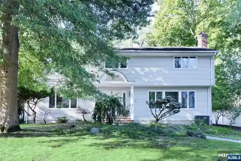 Well-Kept Center Hall Colonial Situated in a Prime Location